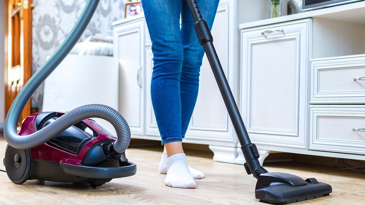 Floor cleaning at home - made easy / woman vacuums 